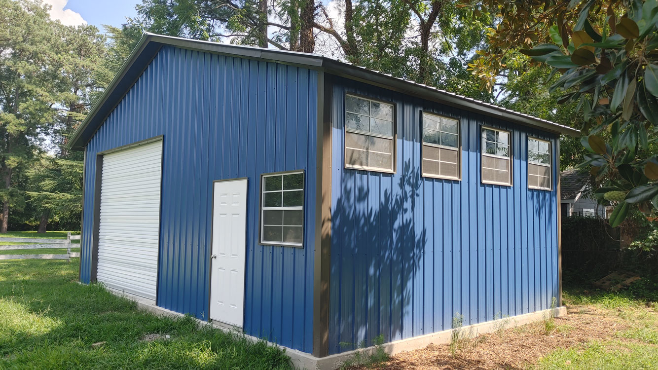 30' wide, 20' long, 11' tall Gallery Blue metal garage with Bright White vertical metal roof and vertical metal siding, anchored to Monolithic Concrete Foundation
